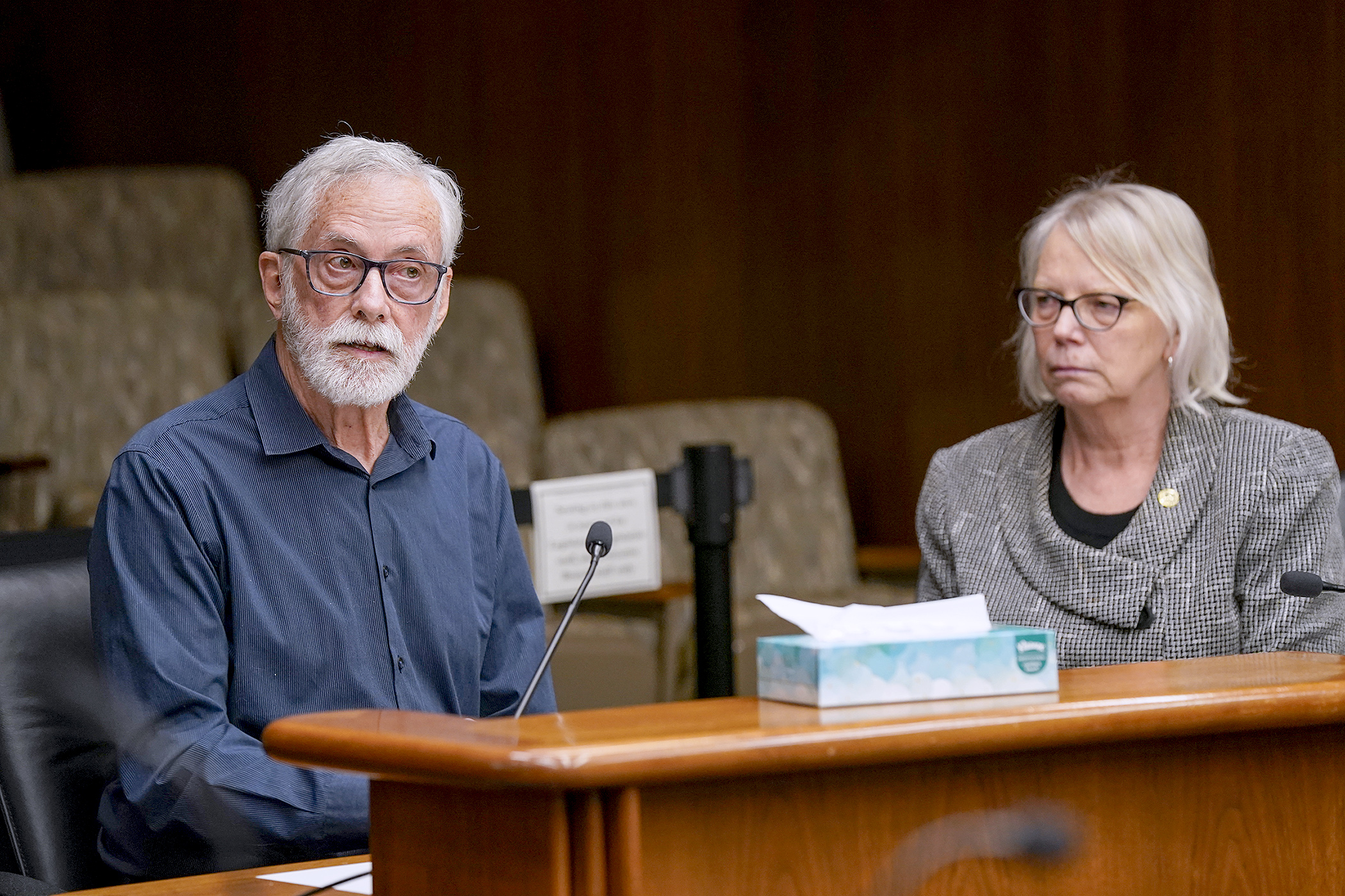 Walt Myers shares his experience with medical debt following the death of his wife. He was testifying before the House Health Finance and Policy Committee March 14 in support of HF1814. Rep. Liz Reyer sponsors the bill. (Photo by Michele Jokinen)